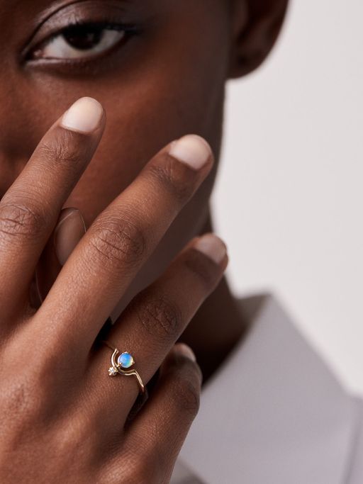 Nestled opal and diamond ring photo