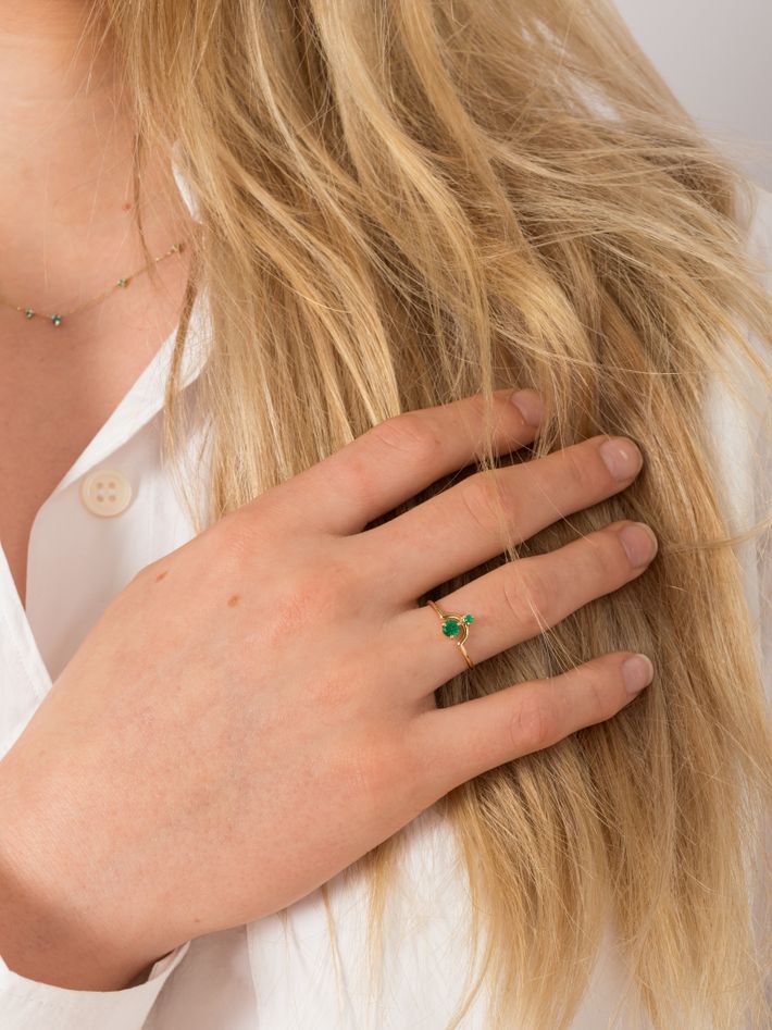 Nestled emerald ring