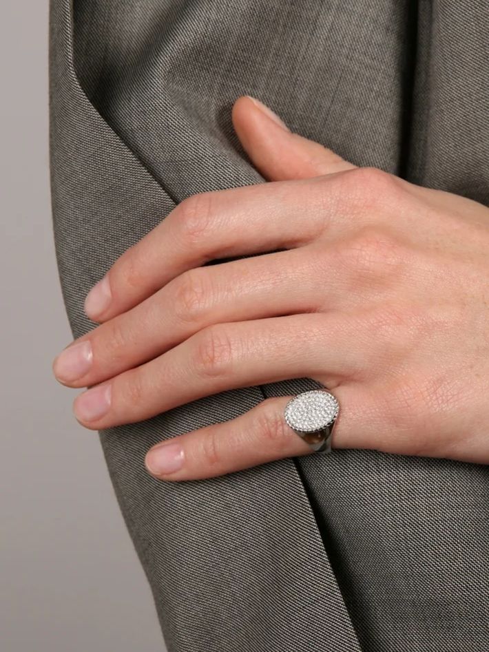 Oval signet ring with white gold diamonds