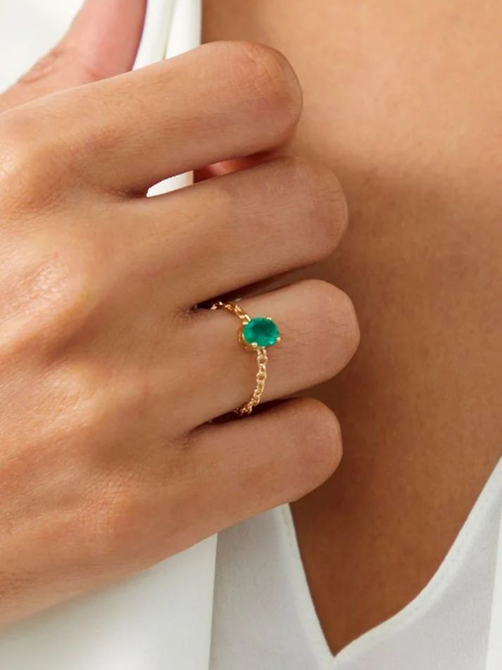 Yellow gold emerald solitaire ring