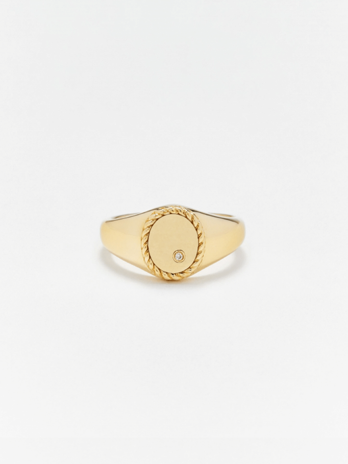 Mini diamond and gold oval signet ring