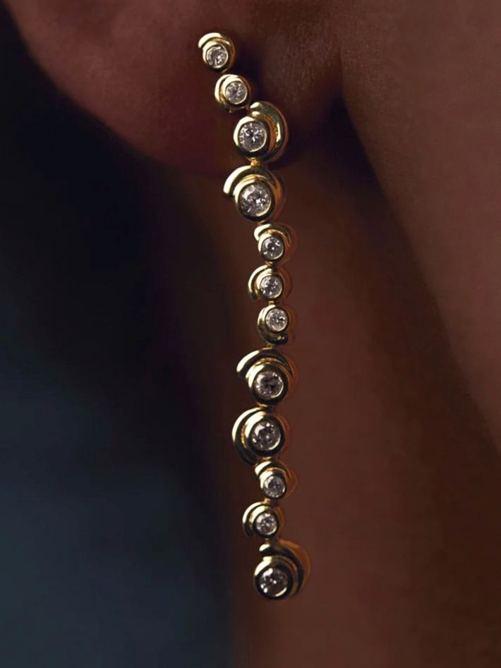 Long yellow gold diamond snail earrings