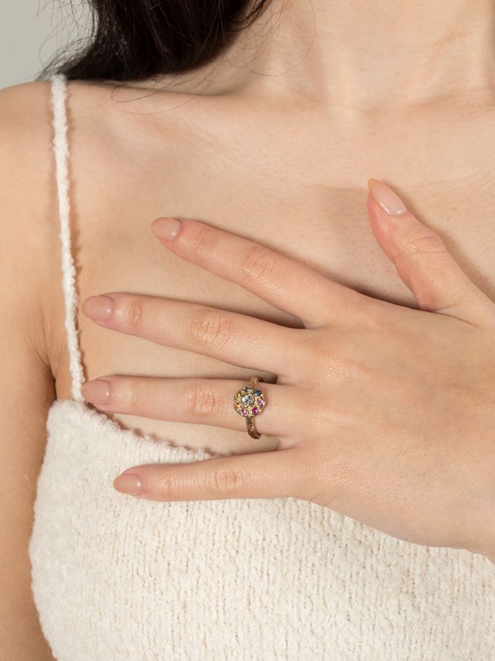 Iridiana rainbow sapphire halo engagement ring