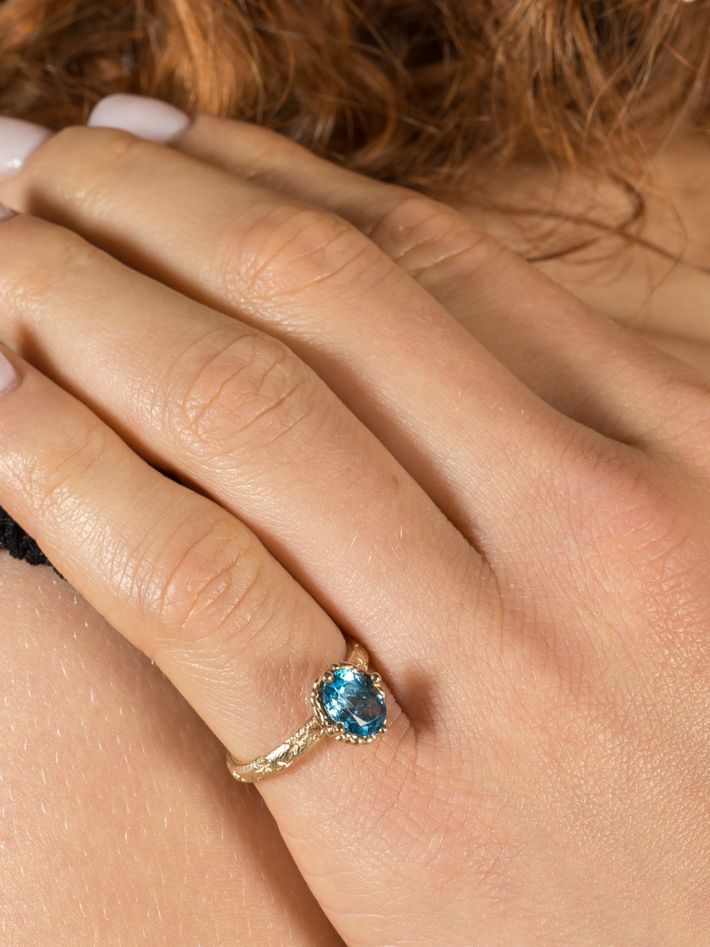 Blue topaz solitaire ring
