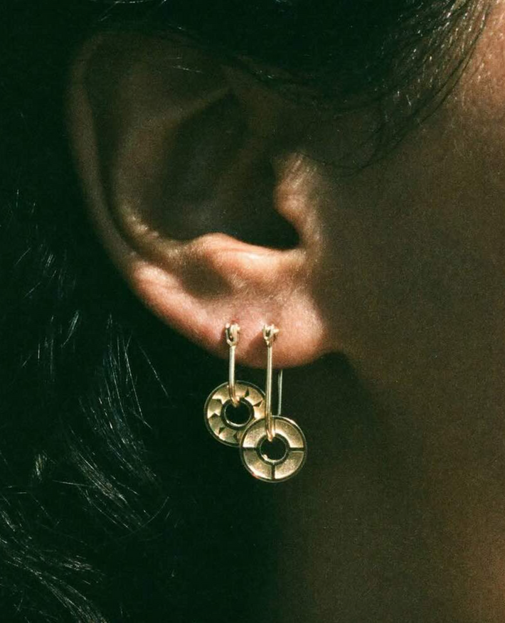 Baby compass earring