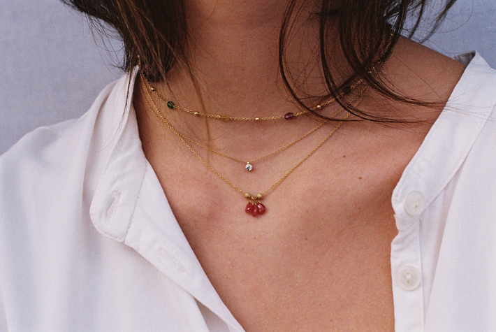 Gold bead and chain necklace with ruby