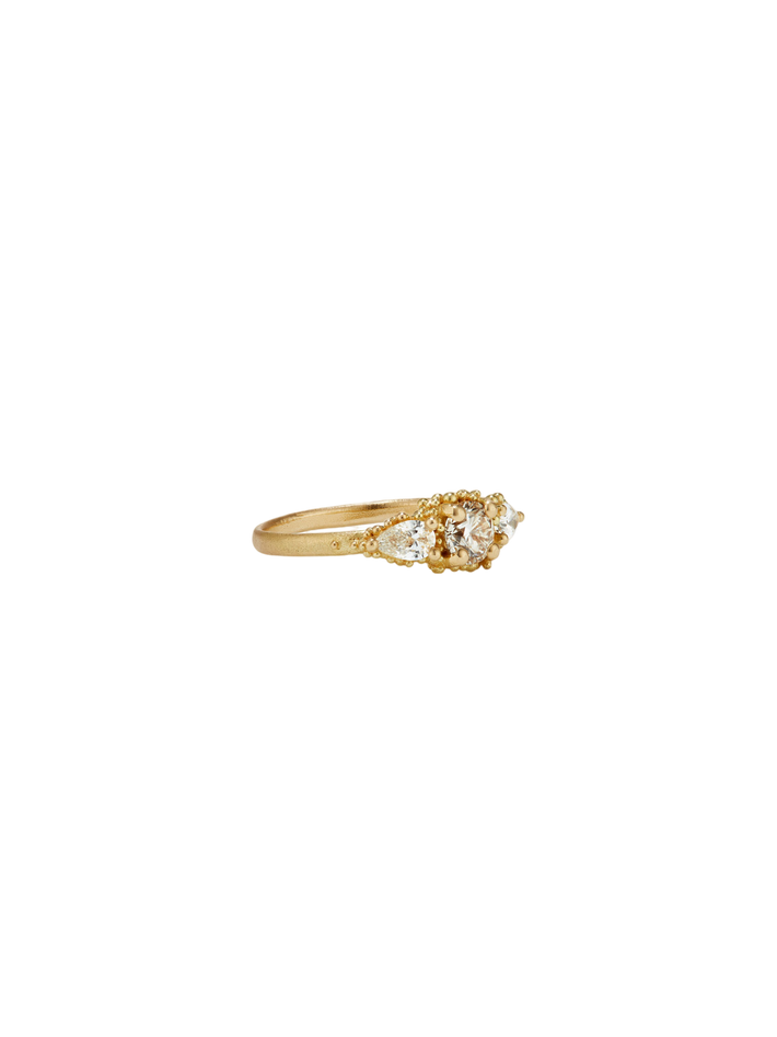 Round raindrop cluster diamond ring
