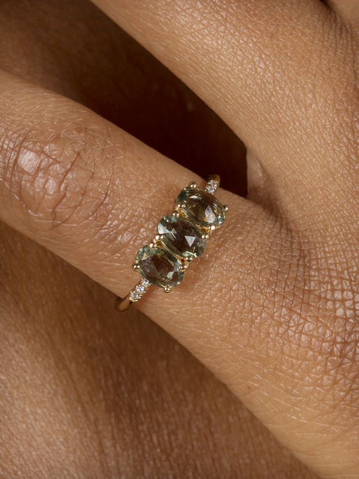 Green sapphire olive equilibrium ring