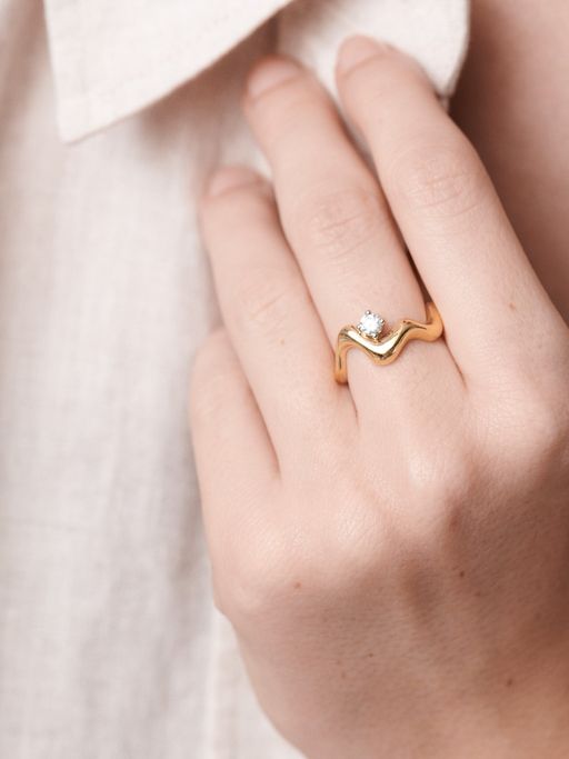 Sculptured curved ring with floating diamond photo