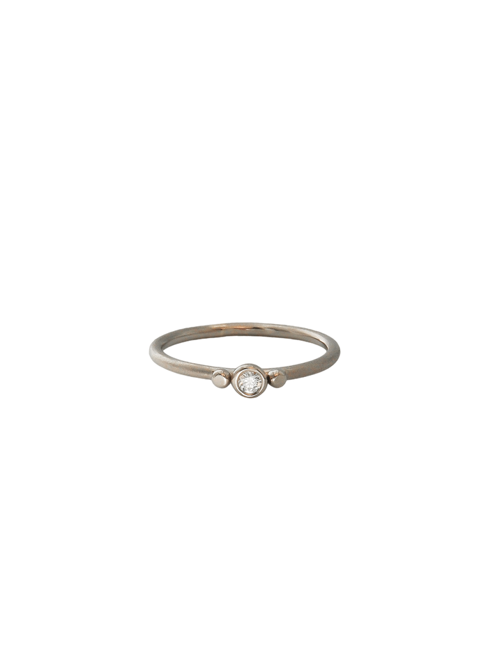 White gold three dots ring with diamond