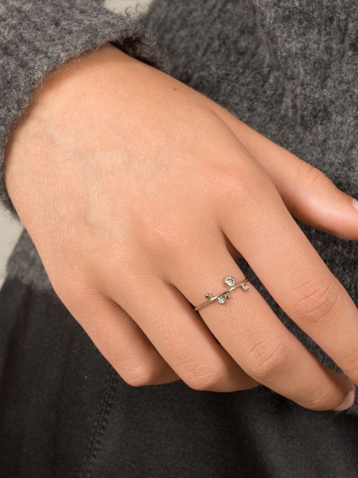 Thin white gold dot ring with diamonds