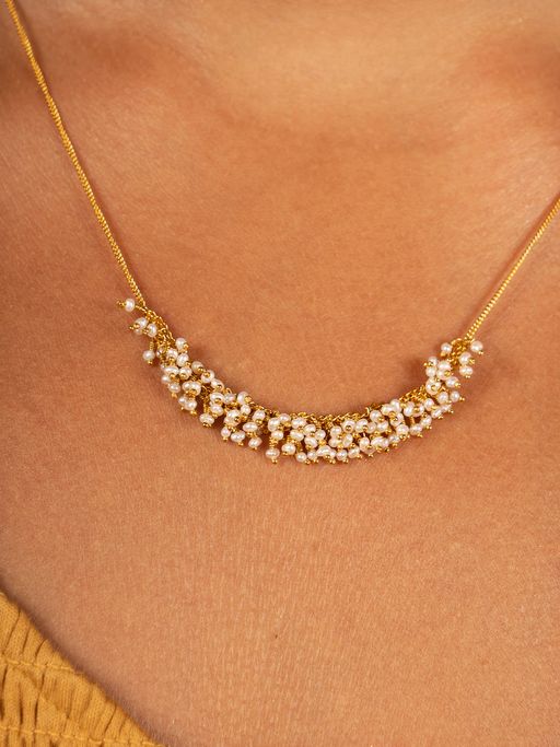 Slender crescent necklace in pearl and gold vermeil photo