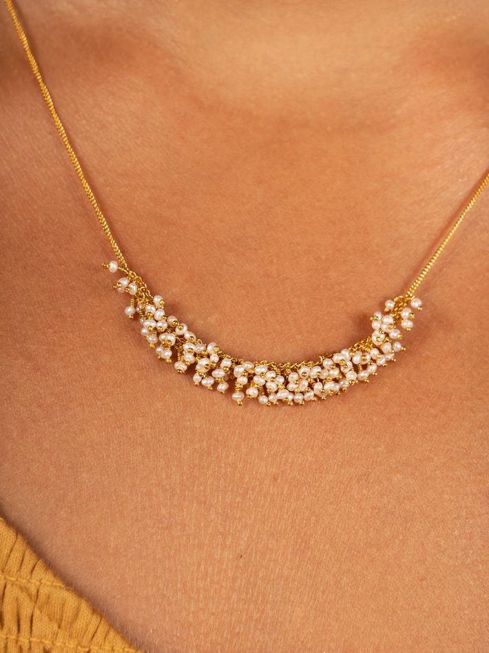 Slender crescent necklace in pearl and gold vermeil