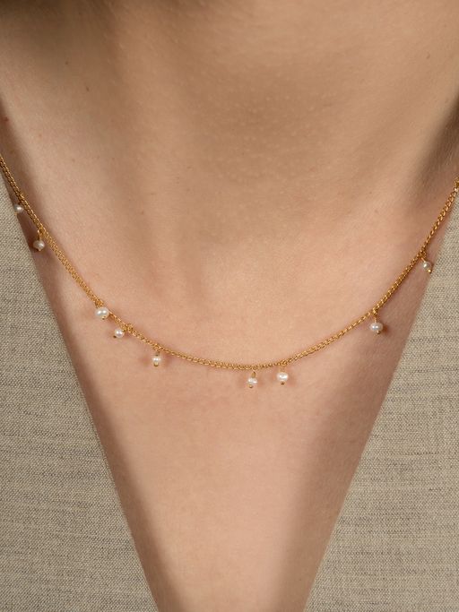 Fine scattered pearl necklace	 photo