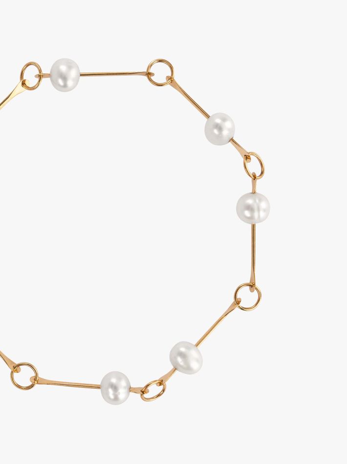 Bone chain bracelet with floating pearls